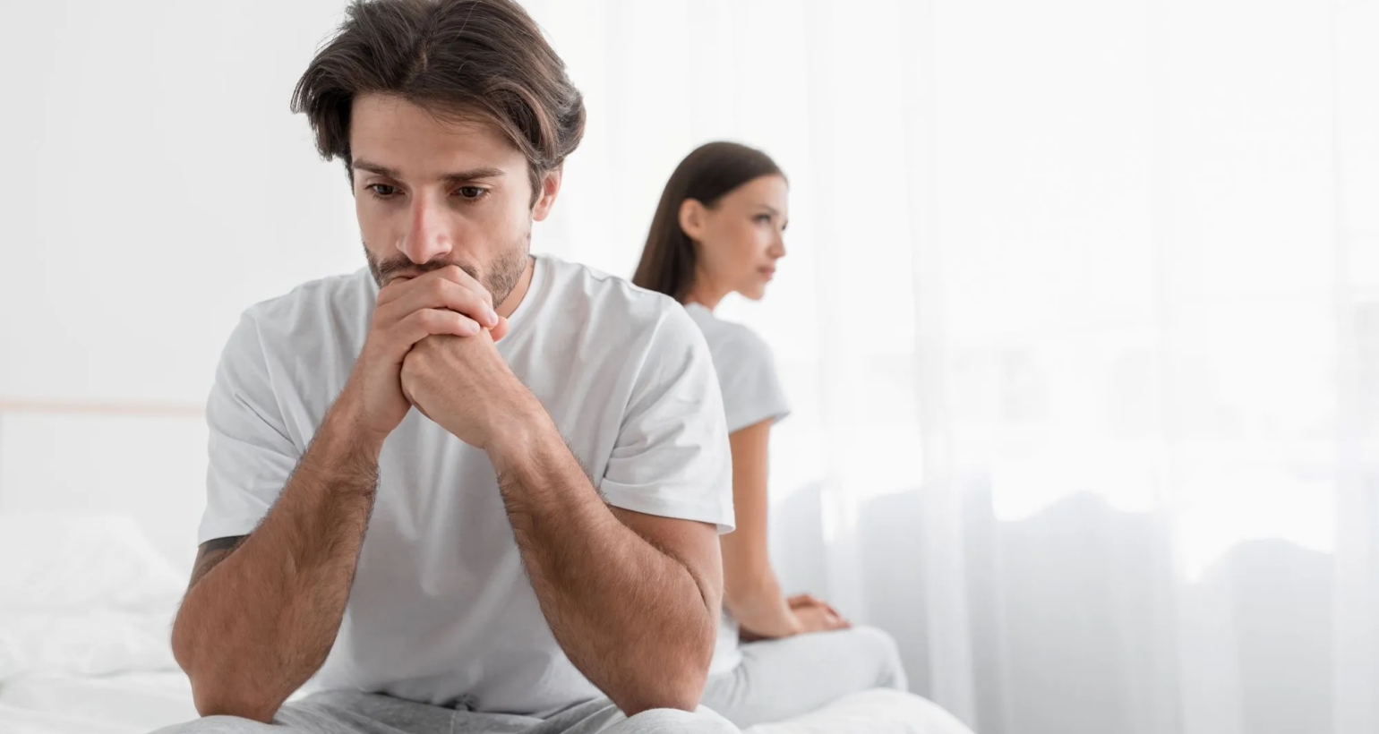 Physician evaluating causes of erectile dysfunction including performance anxiety and physical ED